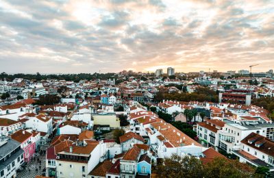 Top view of the city, narrow streets and roofs of houses with red tiles Lisbon
